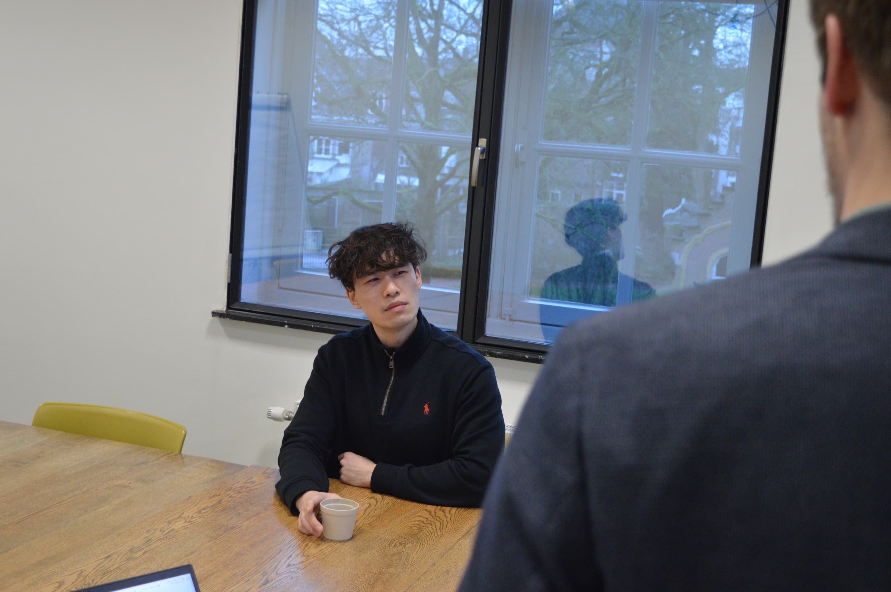 Two people working on AI